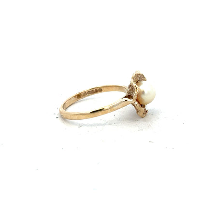 9ct yellow gold ring in size L with a smooth band, unbranded jewelry, showcasing a polished finish and classic design.