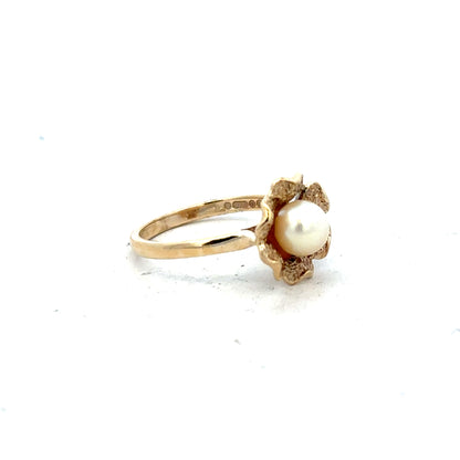9ct yellow gold ring in size L with a simple, smooth band, unbranded, showcasing its elegant shine and craftsmanship.