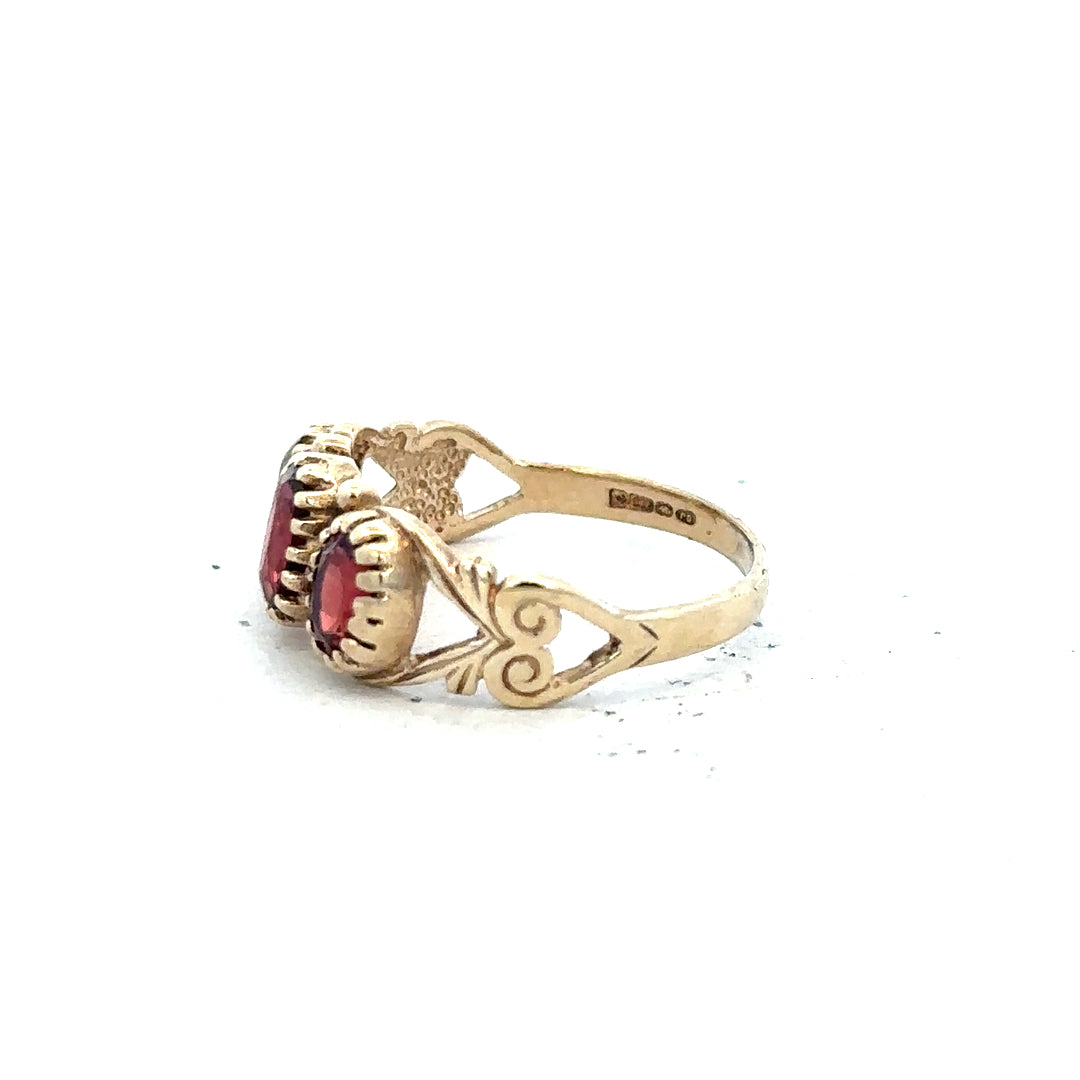 9ct yellow gold ring in size L with a smooth band, unbranded jewelry piece displayed on a plain background.