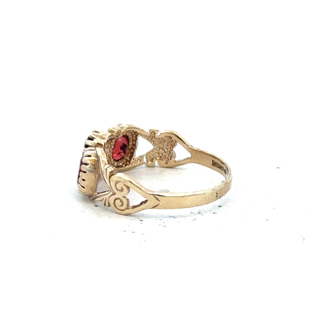 9ct yellow gold ring in size L with a simple, elegant band, unbranded, showcased on a neutral background.