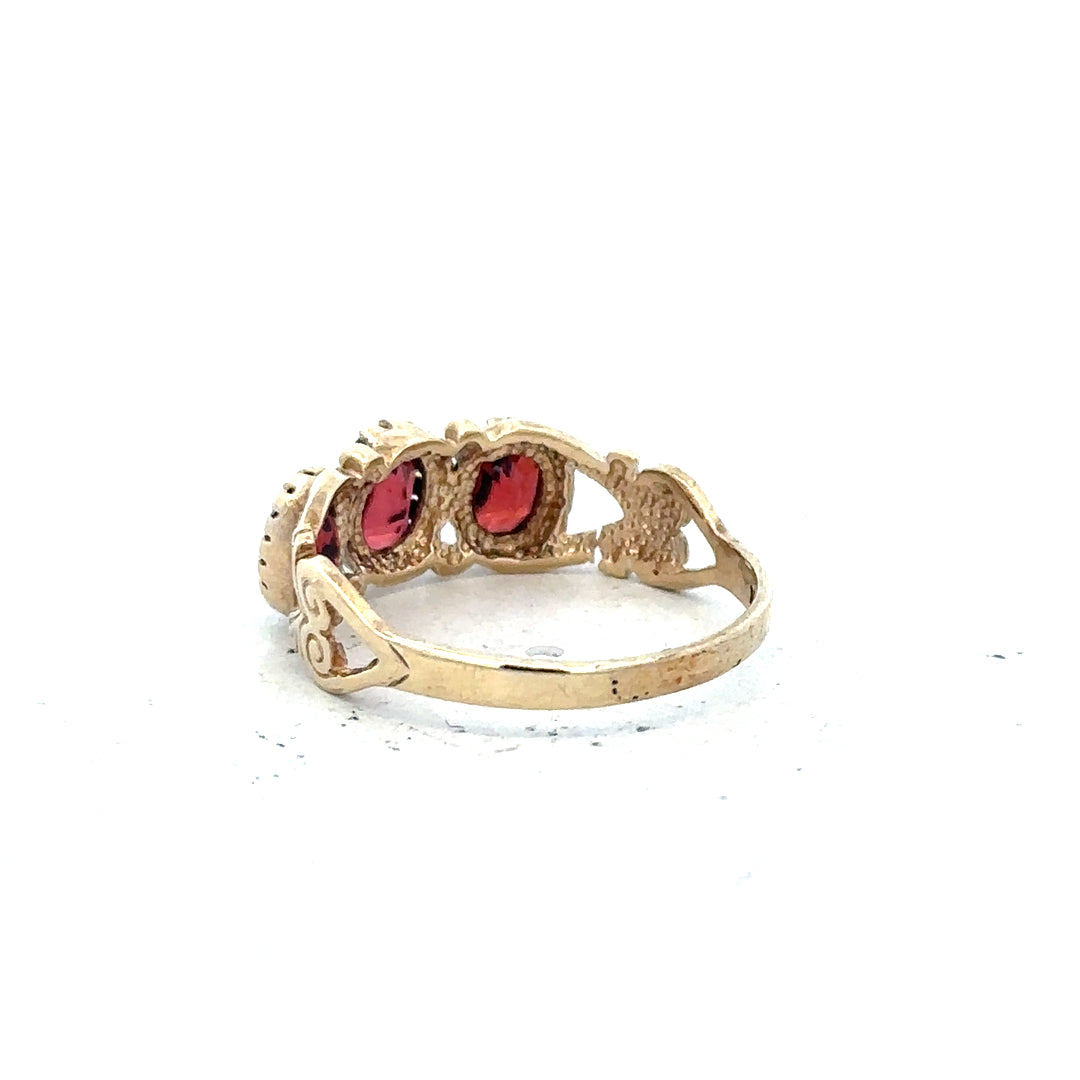9ct yellow gold ring size L with a smooth polished finish, shown in a close-up view highlighting its elegant design.