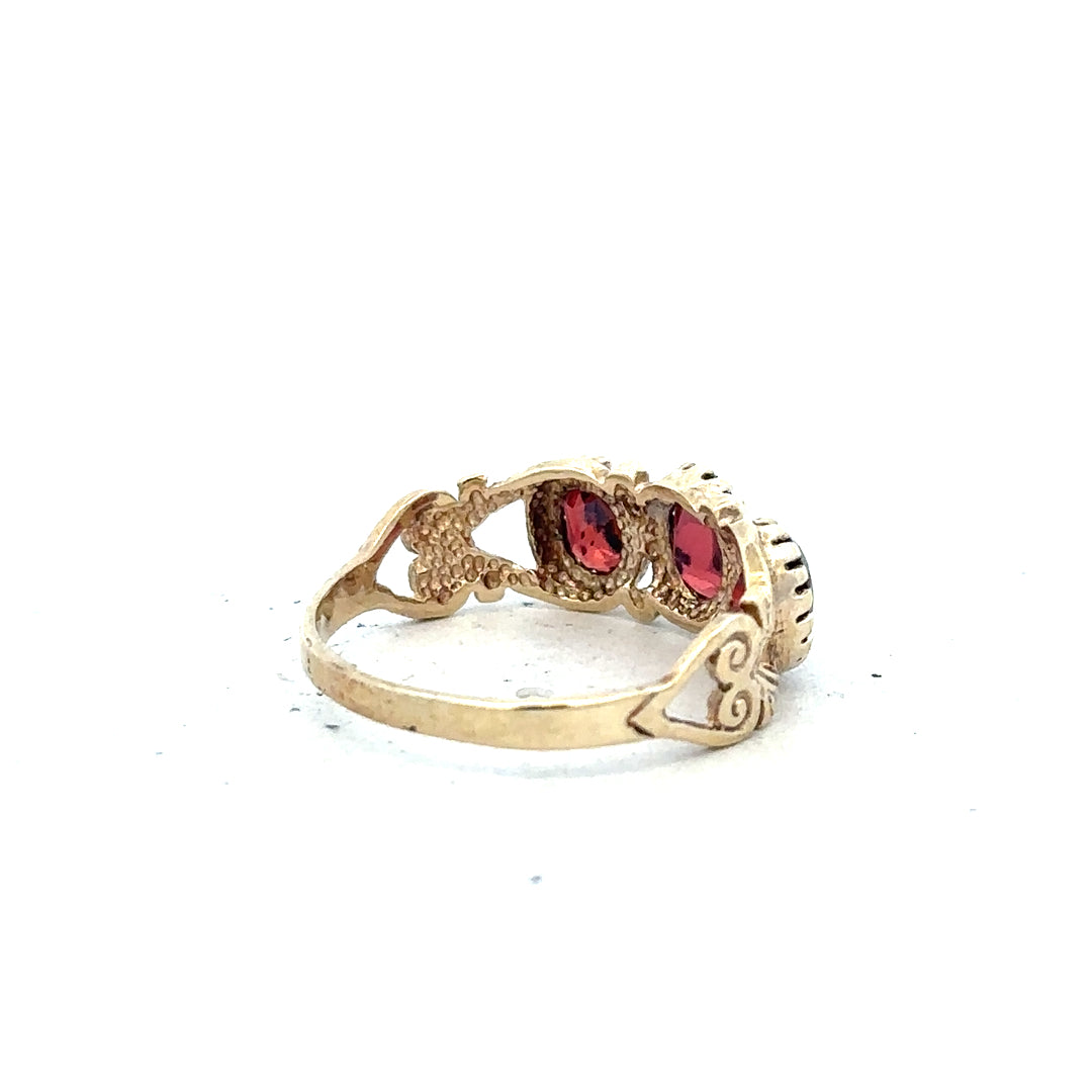 9ct yellow gold ring in size L with a smooth band, unbranded jewelry piece displayed on a neutral background.