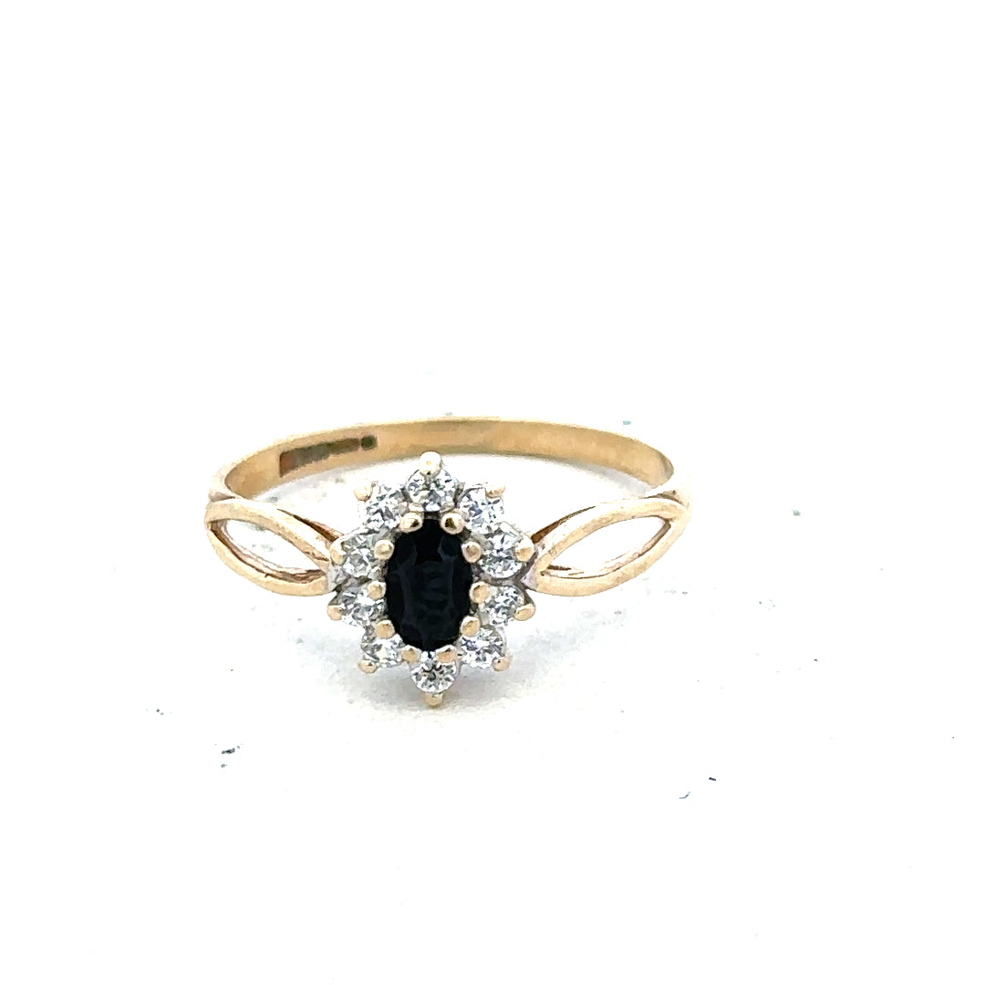 9ct yellow gold ring in size L, featuring a smooth polished band, unbranded jewelry displayed on a plain background.
