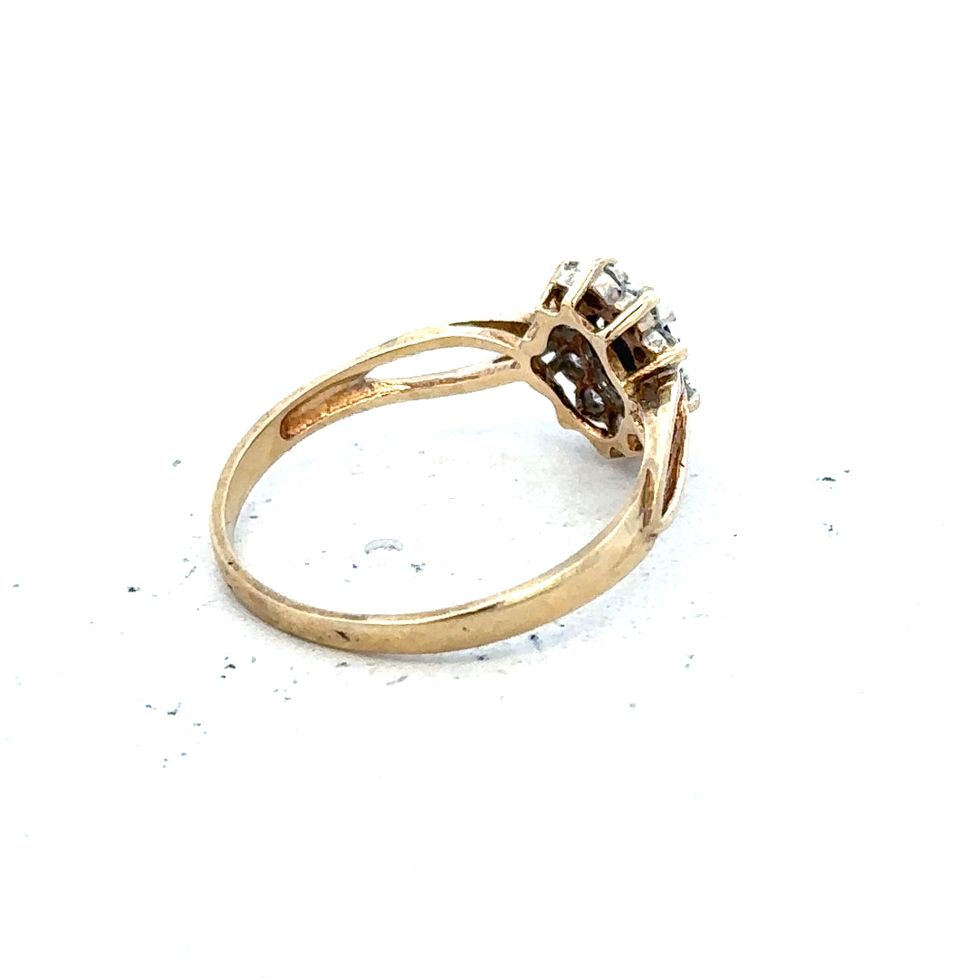 9ct yellow gold ring in size L with a simple polished band, unbranded jewelry, close-up shot showing smooth finish and shine.