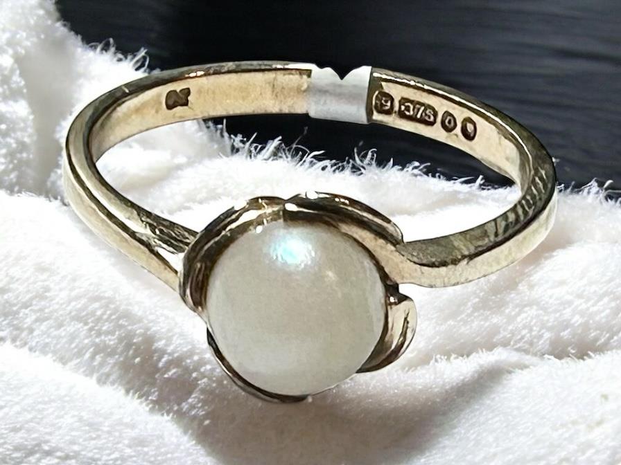 9ct yellow gold ring in size L1/2, unbranded, showcasing a smooth, polished band design.