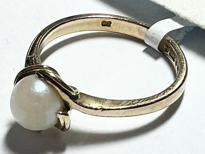 9ct yellow gold ring in size L 1/2 with a smooth band, unbranded jewelry piece displayed on a plain background.