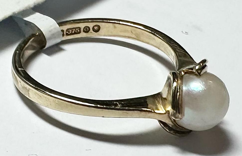 9ct yellow gold ring in size L1/2, featuring a smooth band design, unbranded jewelry image showing the ring's classic style.