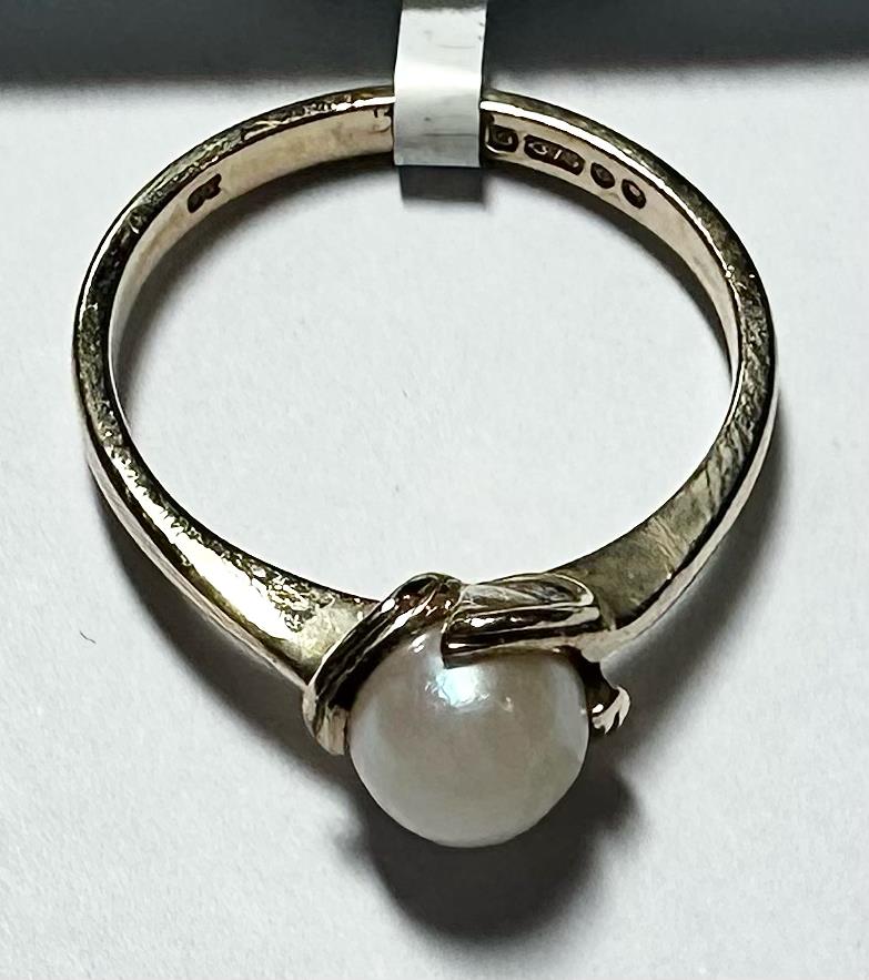 9ct yellow gold ring in size L1/2 with a simple band design, unbranded, showing a close-up of the gold finish and smooth surface.