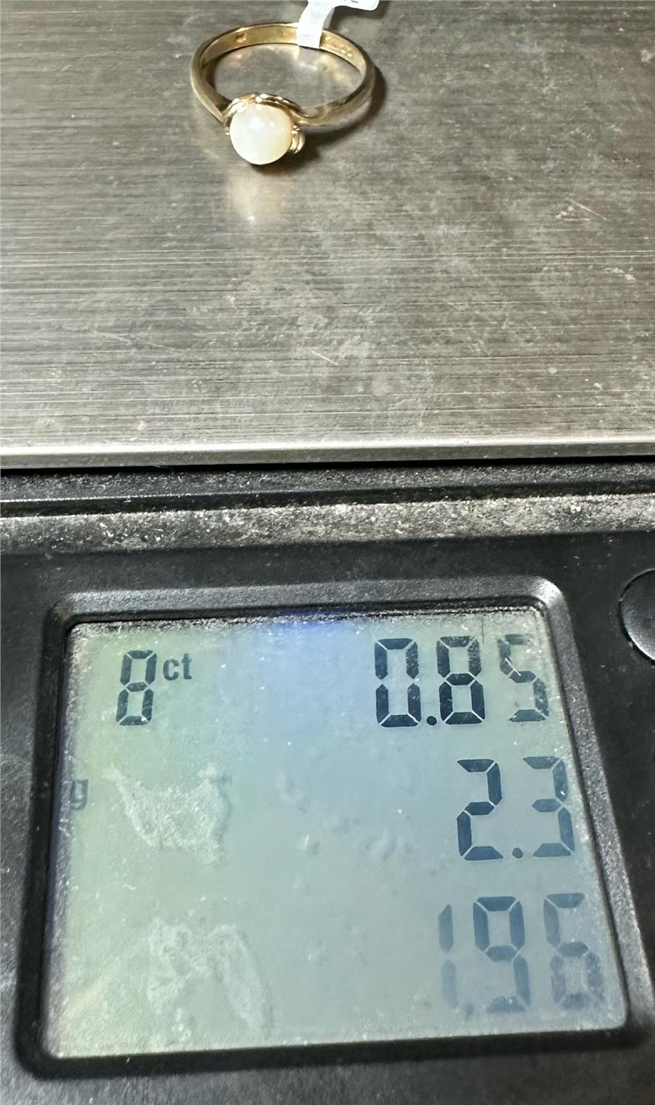 9ct yellow gold ring in size L1/2 with a simple band design, unbranded, shown in a close-up image.