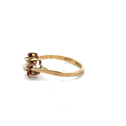 9ct yellow gold ring in size L1/2 with a simple band design, shown in a close-up view.