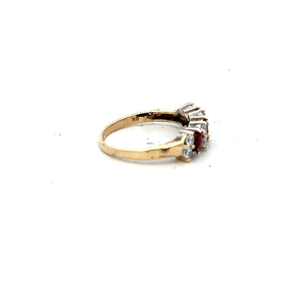 9ct yellow gold ring in size L1/2 with a simple band, shown from a side angle. Unbranded jewelry piece.