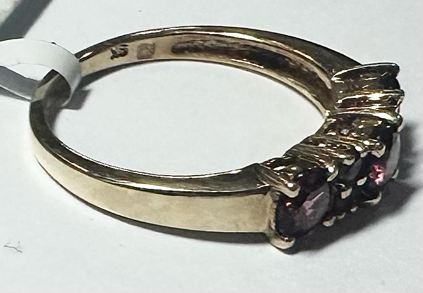 9ct yellow gold ring in size M with a smooth band, unbranded jewelry, shown on a plain white background.