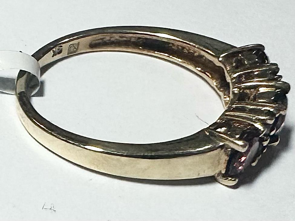 9ct yellow gold ring in size M with a simple, elegant band, unbranded jewelry displayed on a neutral background.