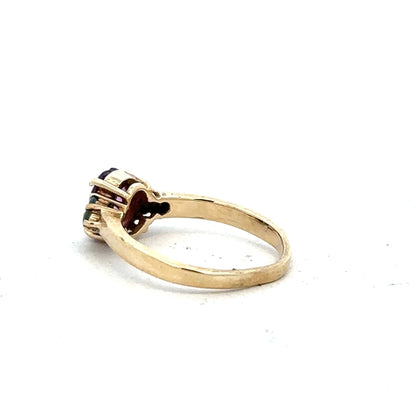 9ct yellow gold ring in size M with a smooth band, unbranded, showcasing a shiny, polished finish.