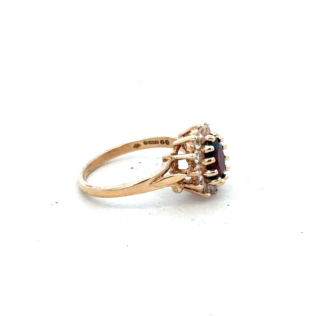 9ct yellow gold ring in size M with a smooth polished finish, unbranded jewelry piece on a plain background.
