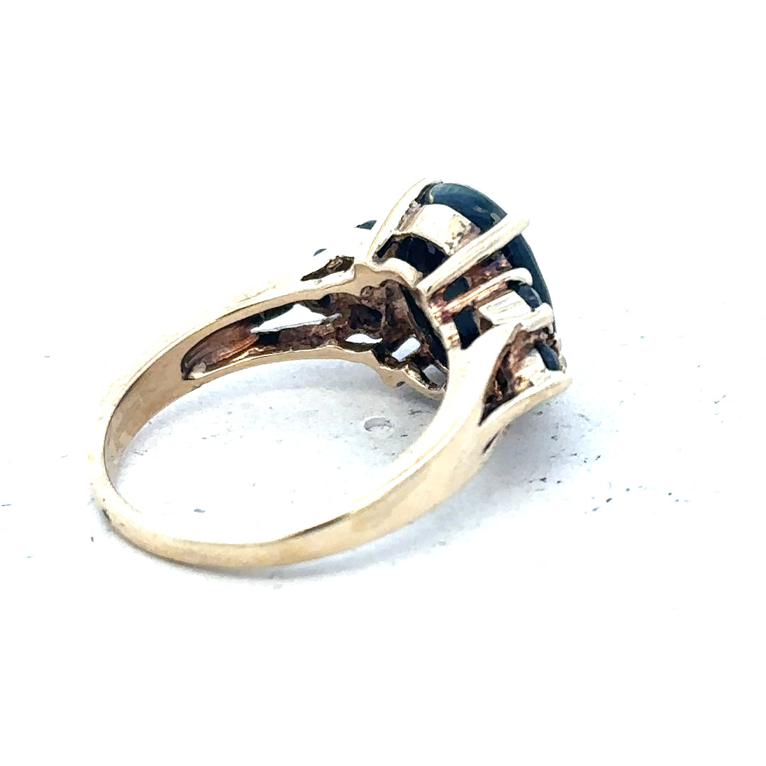 Yellow gold ring in size M1/2, 9 carats, unbranded jewelry, close-up view of smooth band.