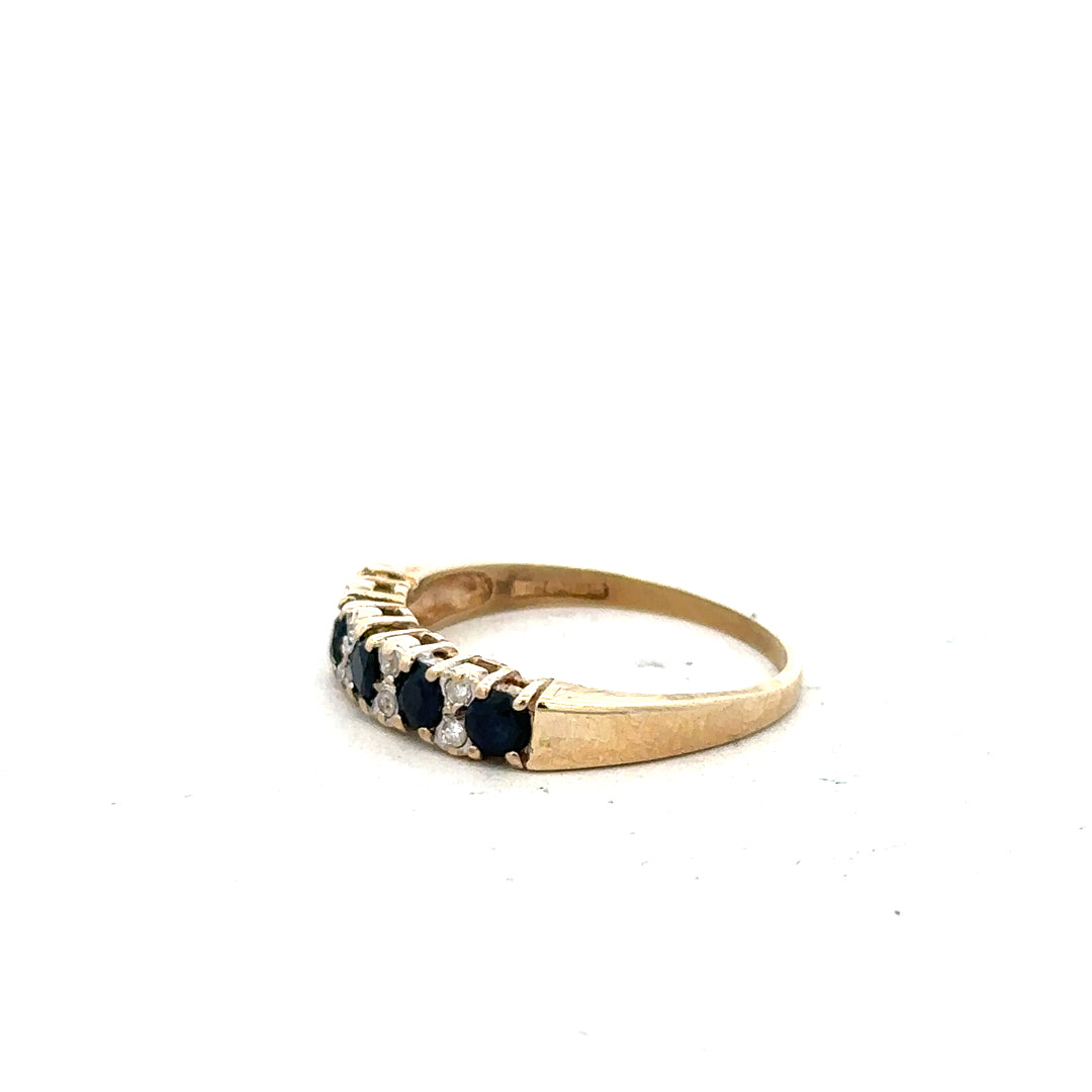 9ct yellow gold ring in size N, featuring a smooth band design, unbranded jewelry displayed against a neutral background.