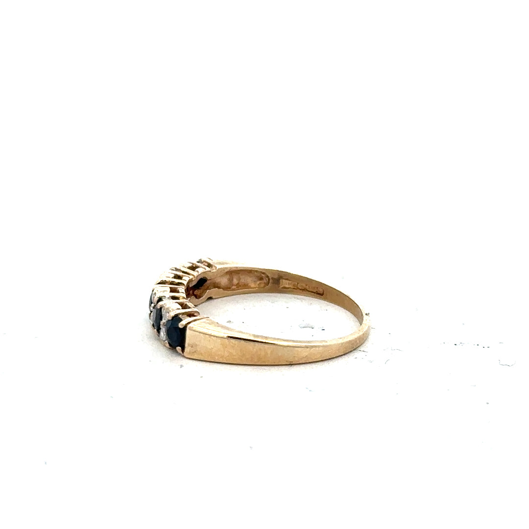 9ct yellow gold ring in size N with a simple band design, unbranded, shown from a side angle.