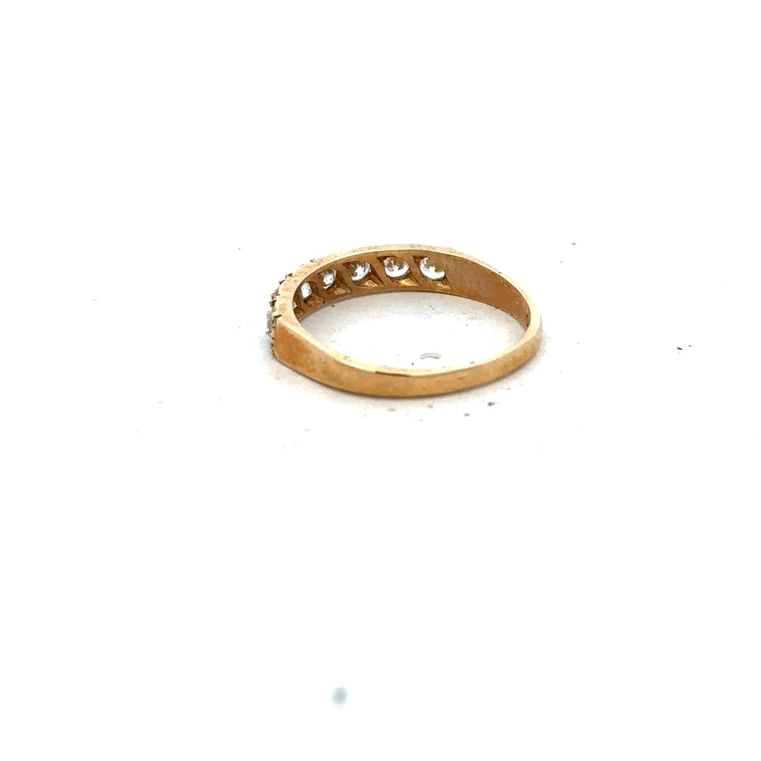 9ct yellow gold ring size N with smooth band, unbranded jewelry piece, detailed close-up of gold craftsmanship.