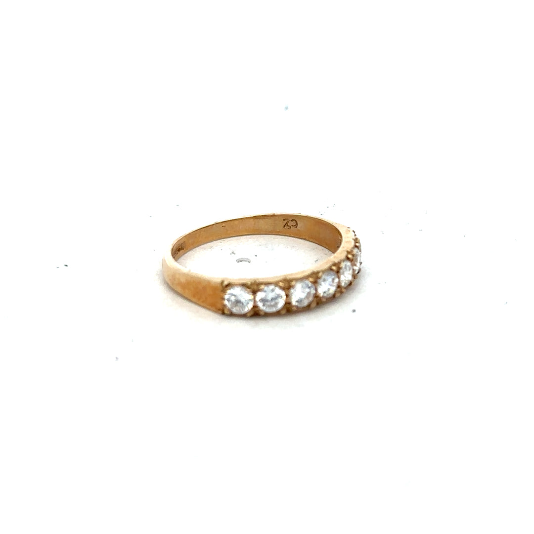 9ct yellow gold ring size N with a smooth band, unbranded jewelry piece resting on a neutral surface.