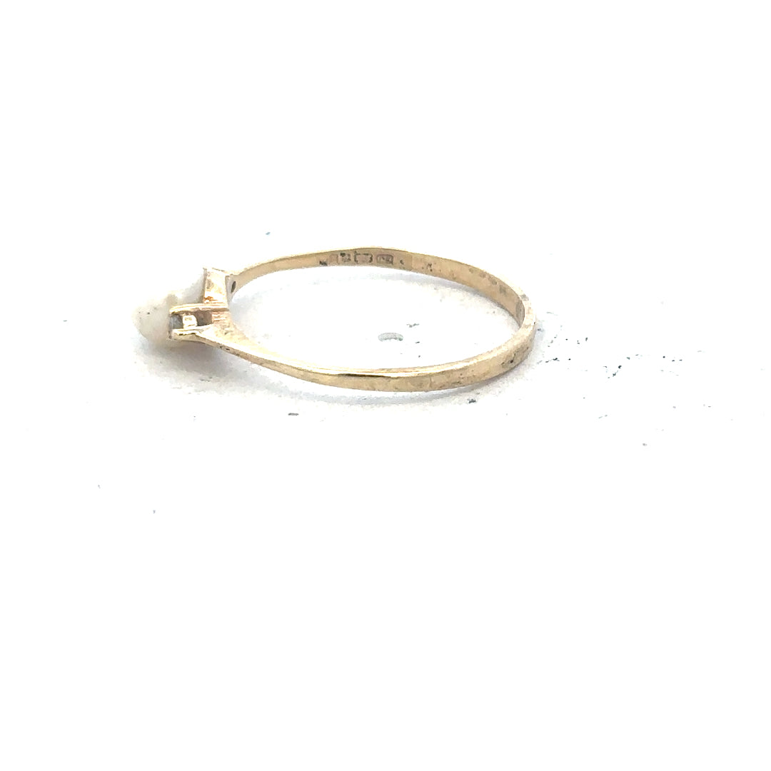 9ct yellow gold ring in size N with a smooth band, showcasing a shiny, polished finish. Unbranded jewelry accessory.