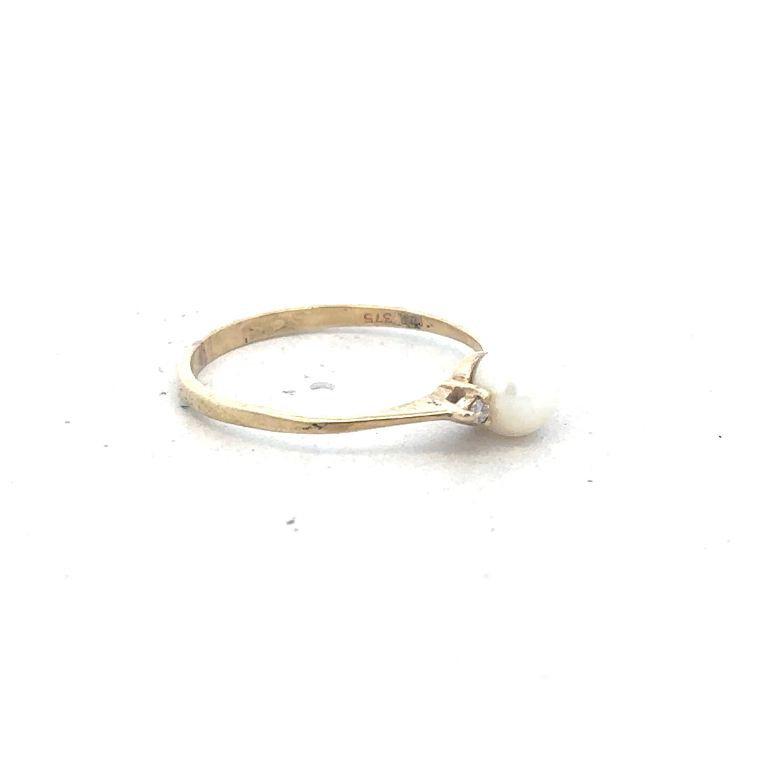9ct yellow gold ring in size N with a smooth polished finish, unbranded jewelry showcasing classic gold craftsmanship.
