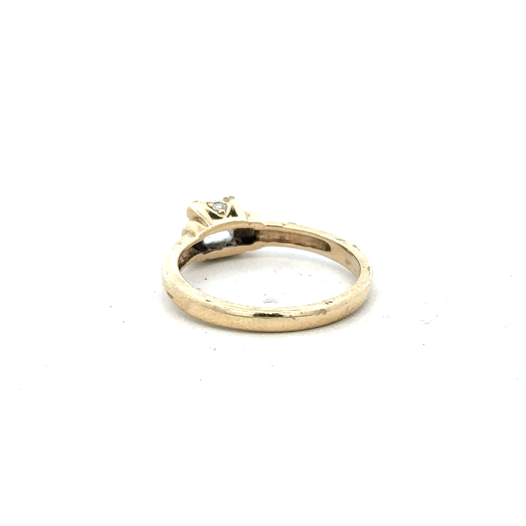 9ct yellow gold ring in size O, featuring a smooth band, unbranded jewelry with a polished finish.
