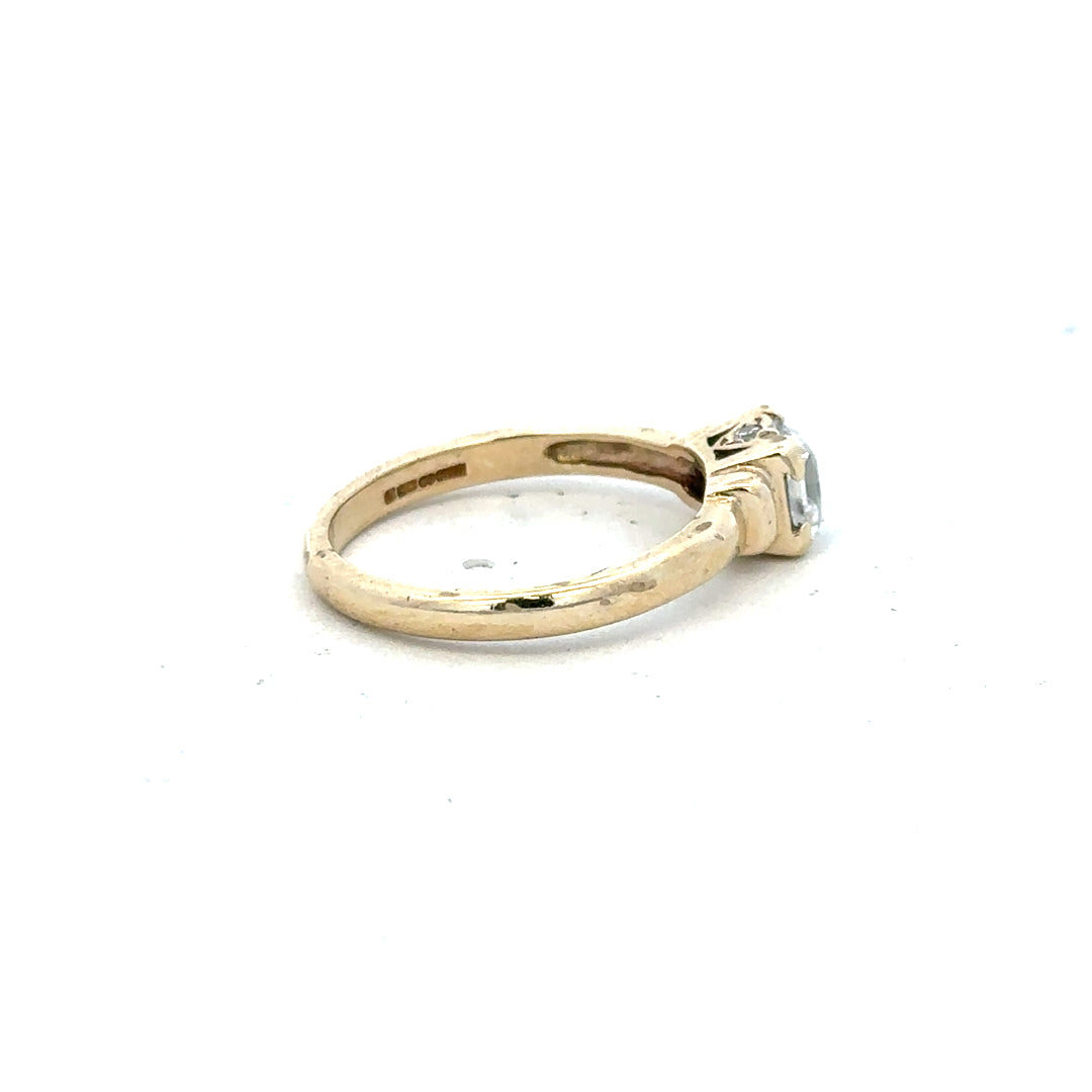 9ct yellow gold ring in size O with a smooth band, unbranded jewelry, shown on a plain background.