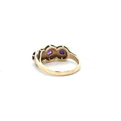 9ct yellow gold ring in size O with a smooth band, unbranded jewelry piece displayed on a neutral background.