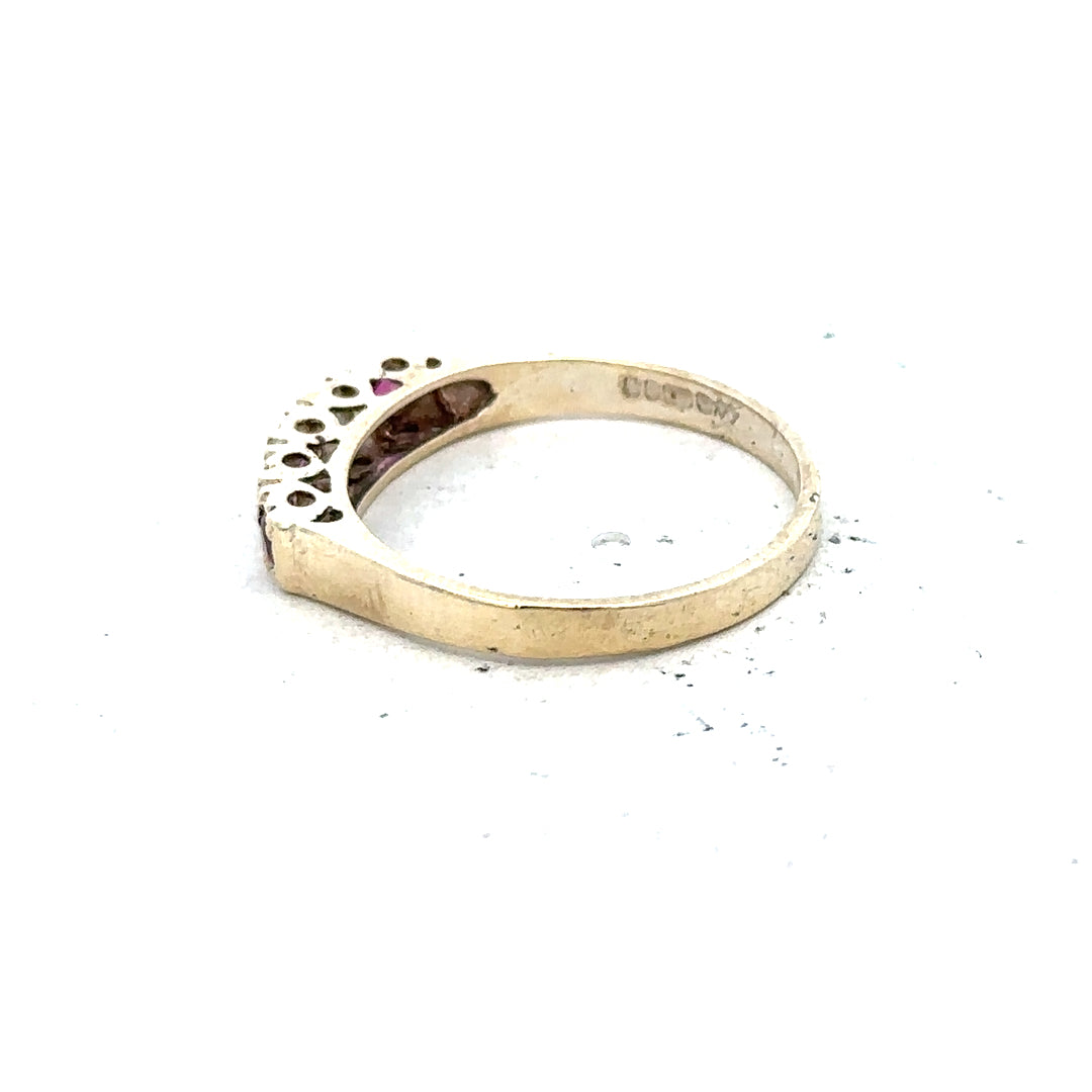 9ct yellow gold ring in size O with a smooth band, unbranded jewelry piece displayed on a plain background.