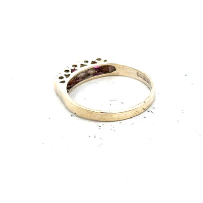 9ct yellow gold ring in size O with a smooth band, unbranded, shown in a close-up image.