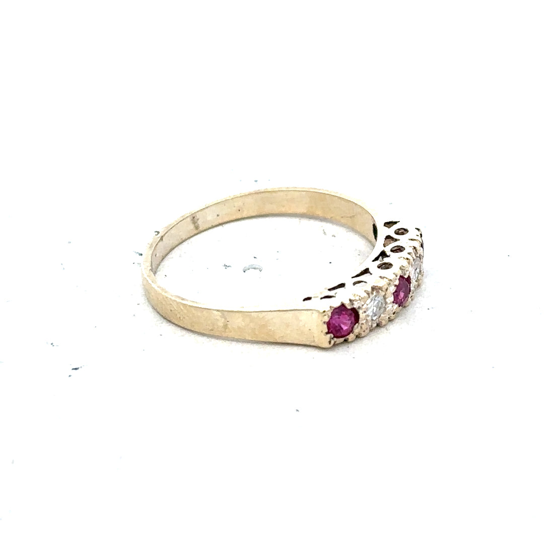 9ct yellow gold ring in size O with a simple band design, unbranded jewelry displayed against a neutral background.
