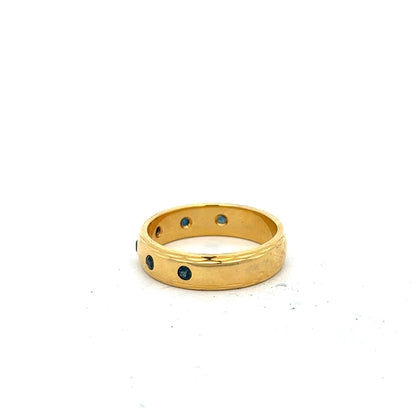 9ct yellow gold ring in size O1/2, unbranded, shown from a side view highlighting its smooth band and polished finish.
