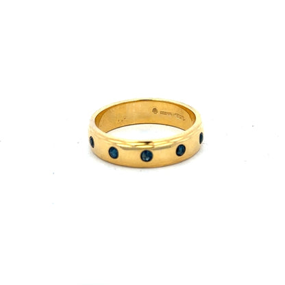 9ct yellow gold ring size O1/2 with a smooth band, unbranded jewelry showing the detailed craftsmanship of the gold ring.