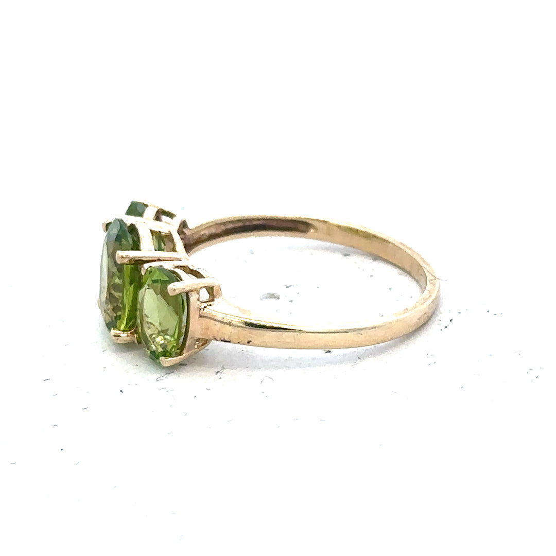 9ct yellow gold ring size P with a smooth polished band, unbranded jewelry showcased on a neutral background.