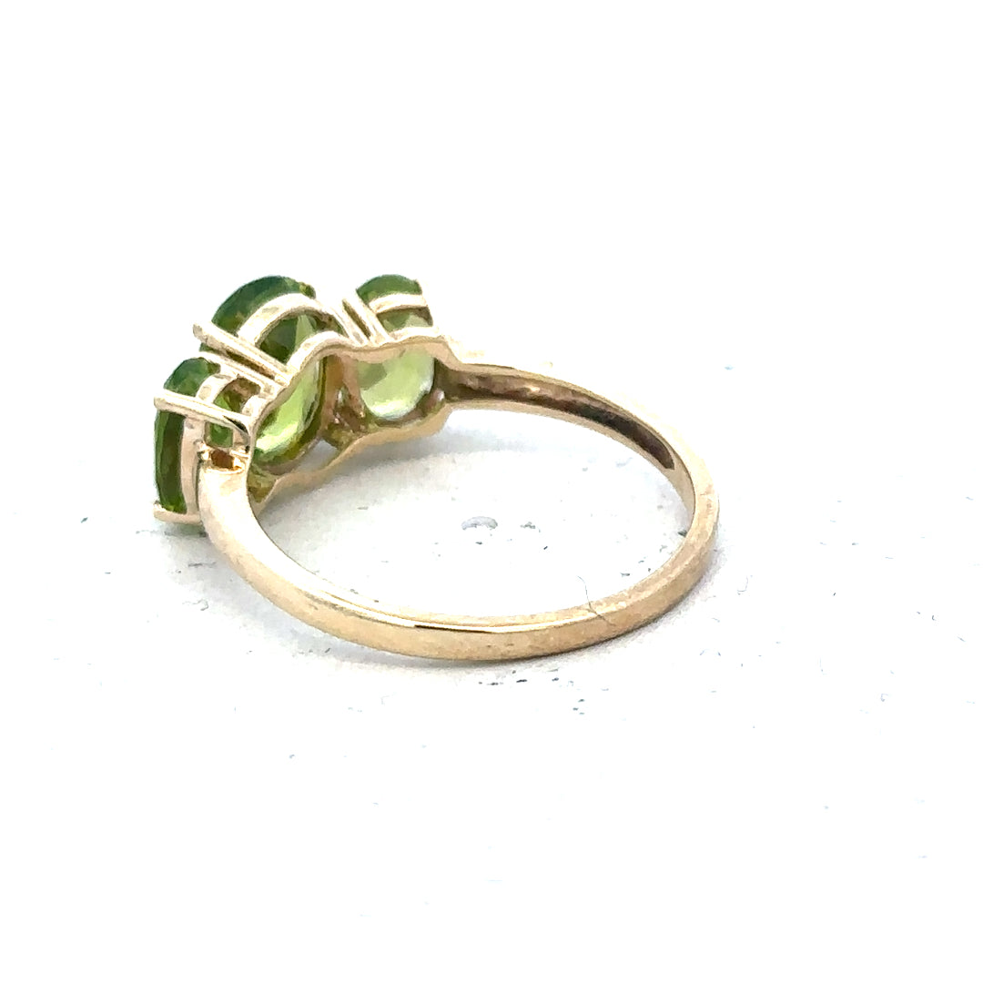 9ct yellow gold ring in size P with a simple band design, unbranded, shown resting on a neutral background.