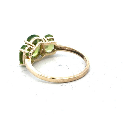 9ct yellow gold ring in size P with a simple band design, unbranded, shown resting on a neutral background.