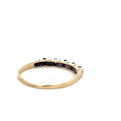 9ct yellow gold ring in size P, featuring a simple smooth band design against a white background.