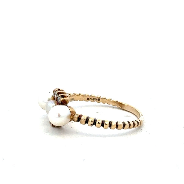9ct yellow gold ring size P with a smooth band, unbranded jewelry piece displayed on a plain background.