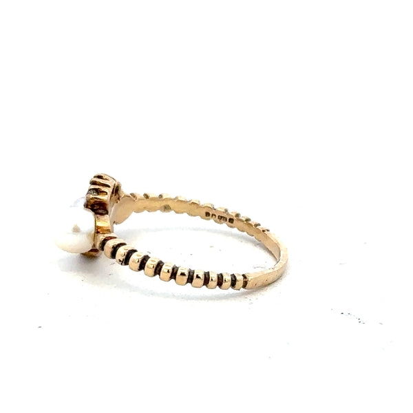 9ct yellow gold ring in size P with a smooth band, unbranded jewelry displayed on a plain background.