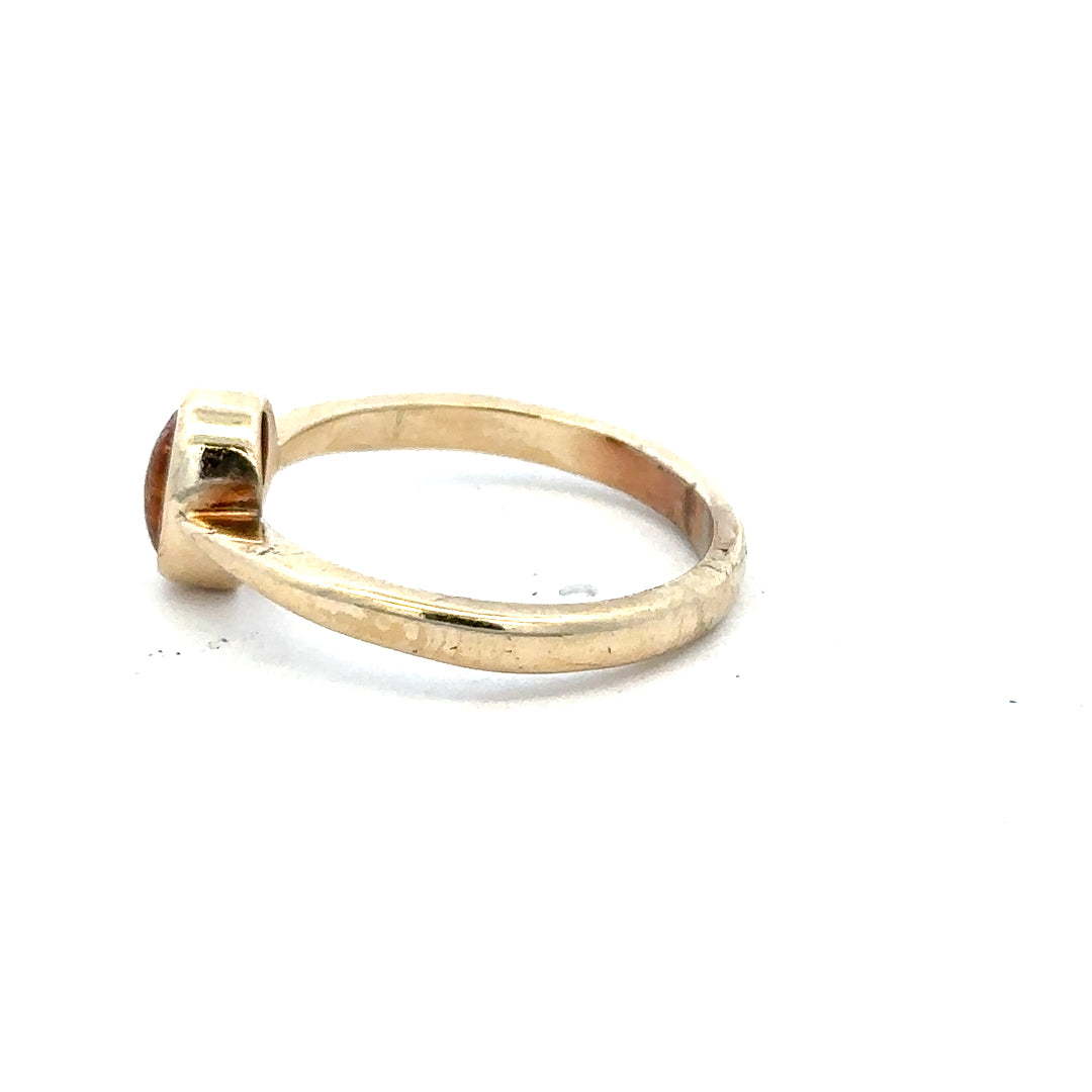 9ct yellow gold ring in size P, featuring a smooth band and classic design, unbranded jewelry displayed against a neutral background.