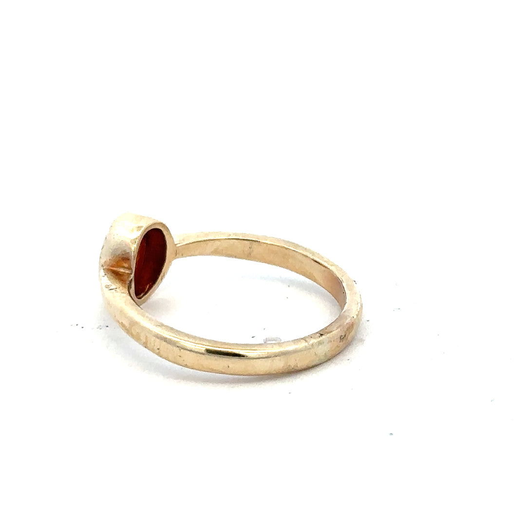 9ct yellow gold ring in size P with a smooth polished band, unbranded jewelry piece on a neutral background.