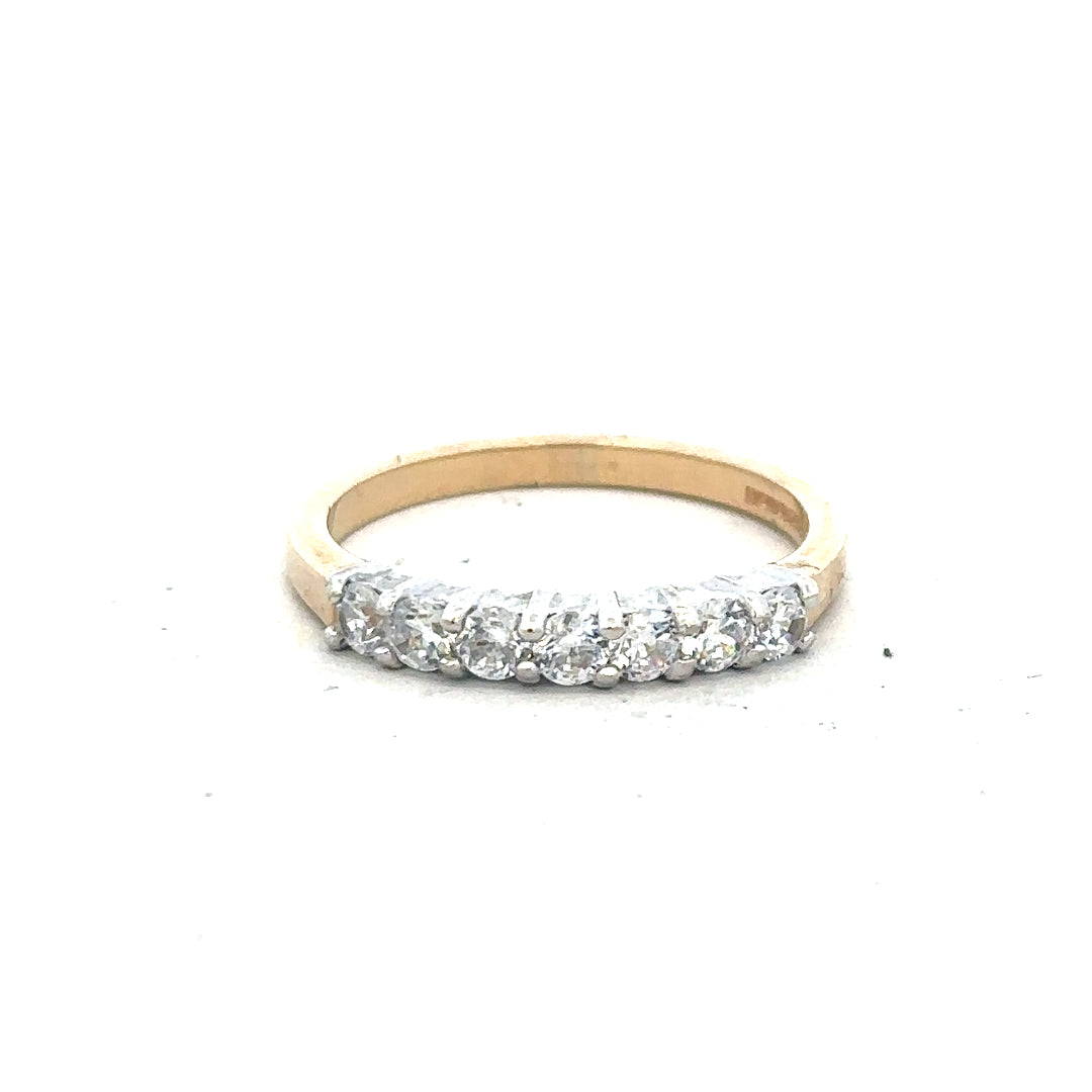 9ct yellow gold ring in size P with a smooth band, unbranded jewelry piece displayed on a plain background.