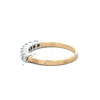 9ct yellow gold ring in size P with a smooth band, unbranded jewelry showing its shiny gold finish.