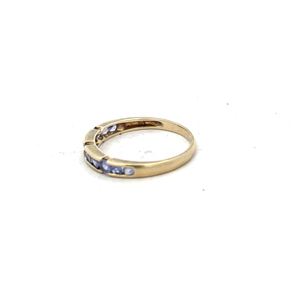 9ct yellow gold ring in size P with a smooth band, unbranded jewelry piece displayed against a plain background.