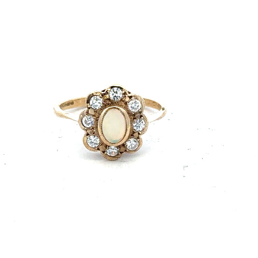 9ct yellow gold ring in size Q with a smooth band, unbranded jewelry piece, shown from a side view.