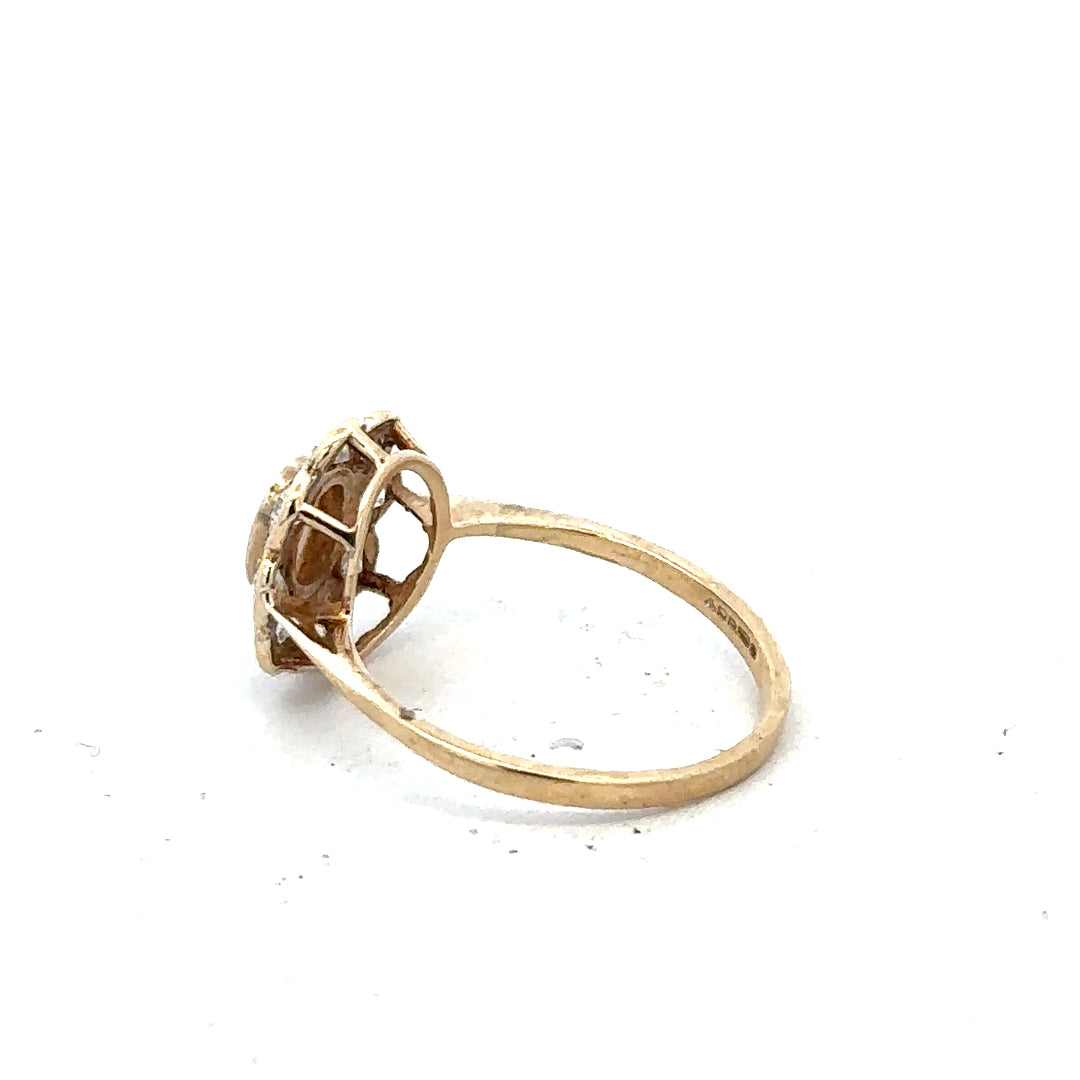 9ct yellow gold ring in size Q with a simple band design, unbranded jewelry displayed on a plain background.