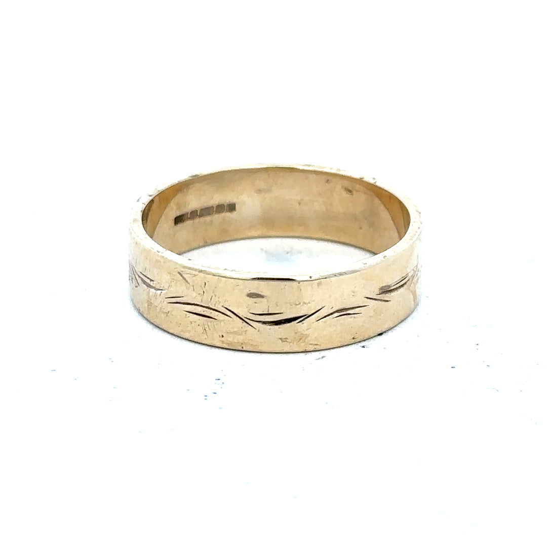 9ct yellow gold ring in size S with a smooth, polished finish, showcasing elegant simplicity and craftsmanship.