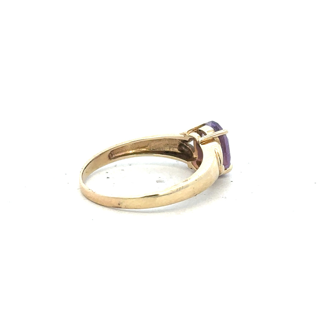 9ct yellow gold ring in size S with a smooth band, unbranded jewelry, shown close-up on a plain background.