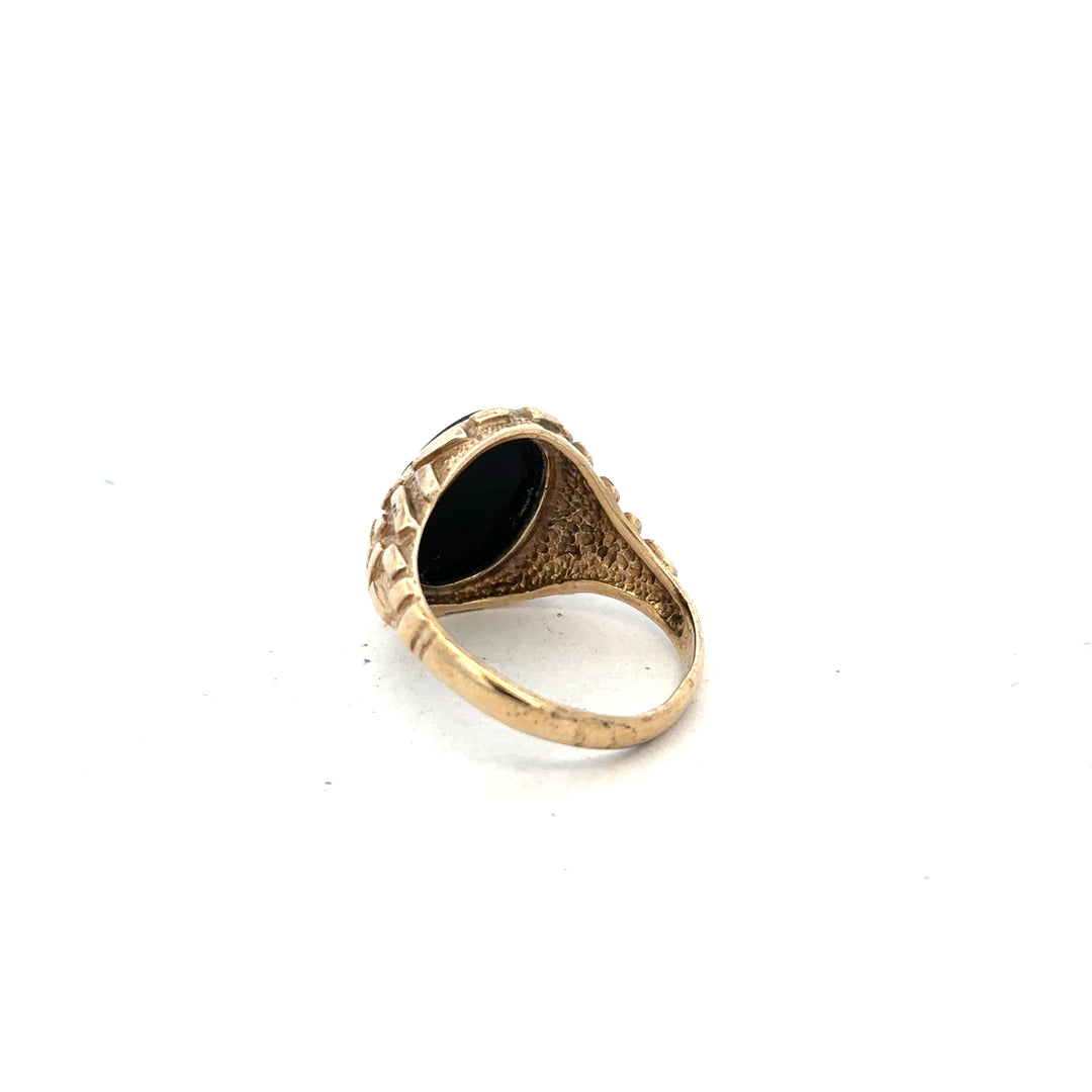 9ct yellow gold ring in size W with a smooth band, unbranded jewelry piece, shown on a plain background.
